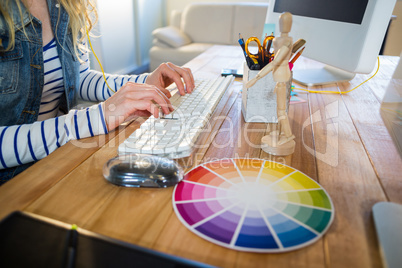Designer typing on keyboard
