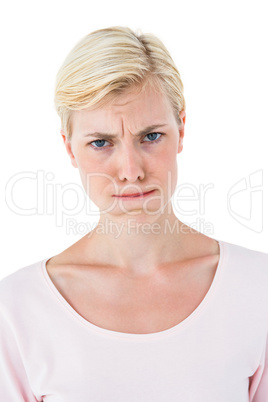 Confused blonde woman looking at camera