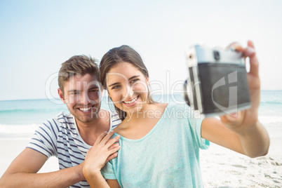 happy couple taking selfie