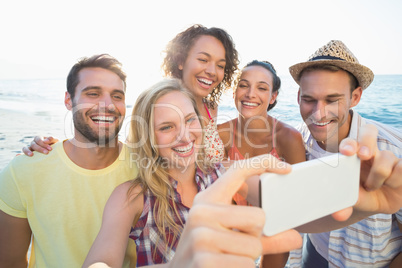 group of friends taking selfies