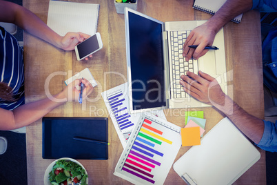 Creative workers sharing desk