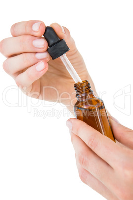 Woman holding bottle of medicine