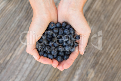 Woman holding blueberries