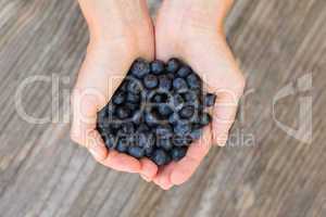 Woman holding blueberries