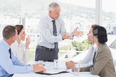 Businessman yelling at his team