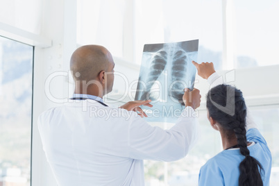 Doctors analyzing together xray