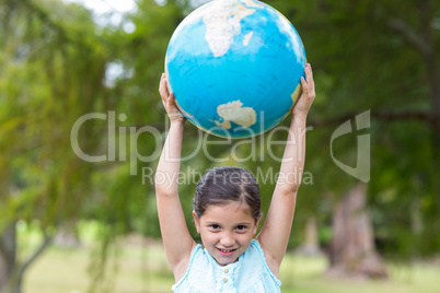 Little girl holding a globe