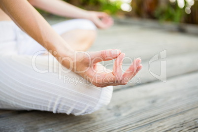 Fit woman meditating