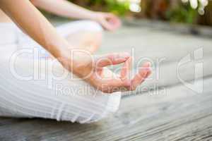 Fit woman meditating