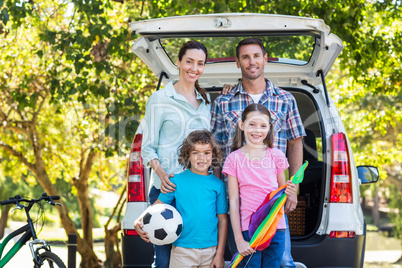 Happy family getting ready for road trip