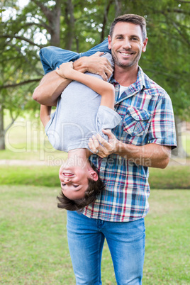 Father and son having fun in the park