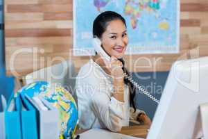 Pretty businesswoman having phone call