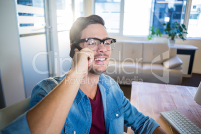 Casual businessman speaking at the phone