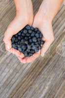 Woman holding blueberries