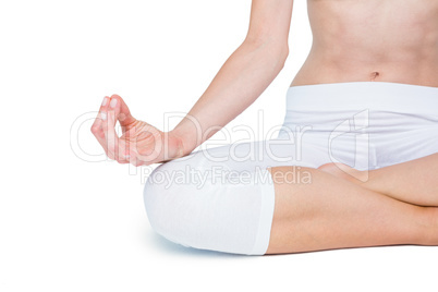 Fit woman meditating