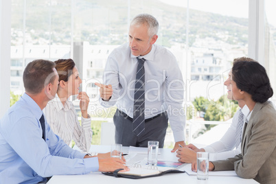 Businessman talking to his team