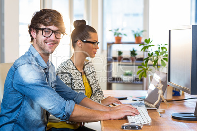 Smiling casual business team working together