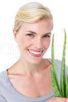 Attractive woman holding aloe vera plant