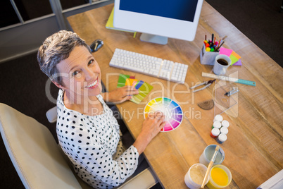 Casual businesswoman working with colour chart
