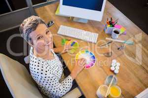 Casual businesswoman working with colour chart