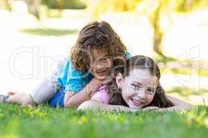 Little siblings smiling at camera