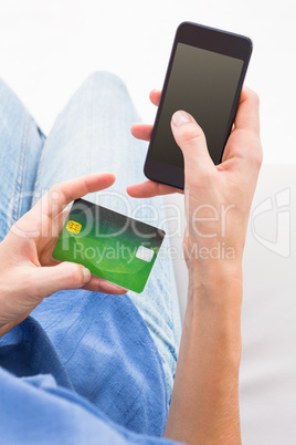 Woman doing online shopping with her mobile phone