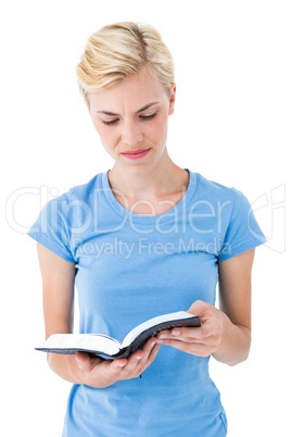 Blonde woman reading bible
