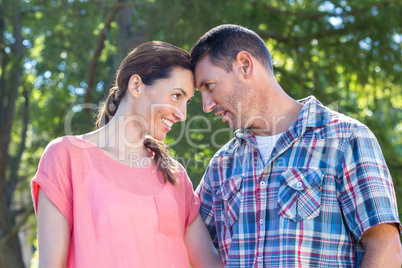 Happy couple smilling in park