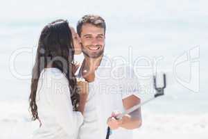 happy couple taking selfie