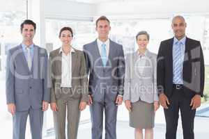 Business people standing in a row