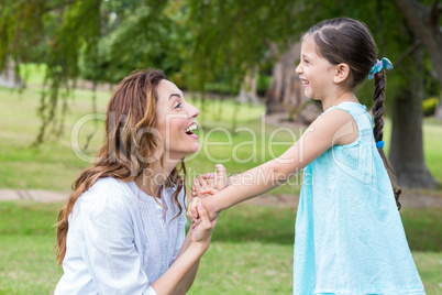 Happy mother and daughter smiling