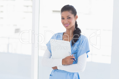 Smiling doctor looking at camera