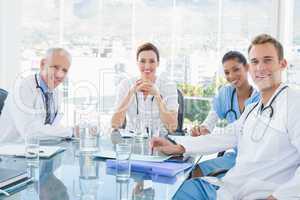 Team of smiling doctors having a meeting