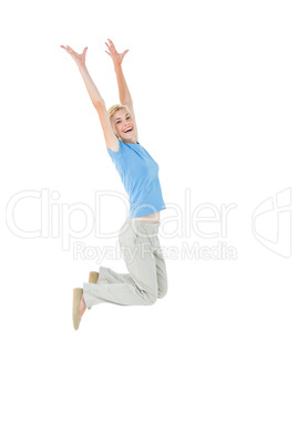 Cheerful blonde woman jumping