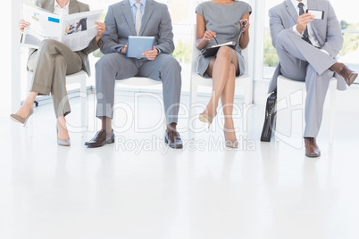 Business people sitting and waiting