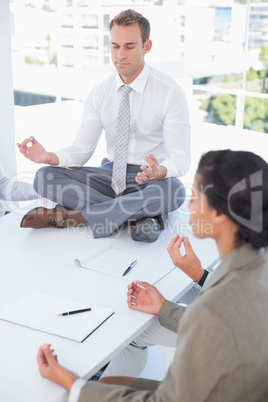Business team relaxing eyes closed