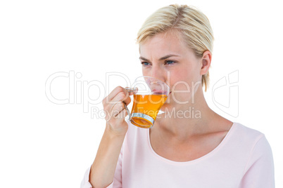 Attractive blonde woman drinking tea