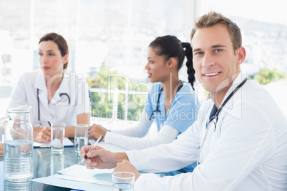 Team of smiling doctors having a meeting