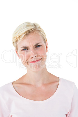 Confused blonde woman looking at camera