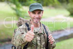 Soldier looking at camera thumbs up