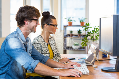 Smiling casual business team working together