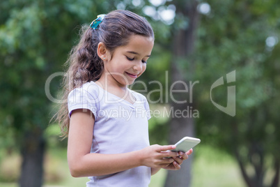 Little girl using her phone
