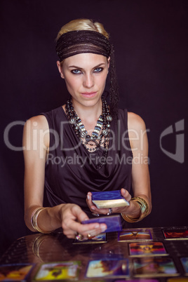 Fortune teller forecasting the future with tarot cards