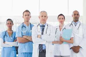 Team of smiling doctors looking at camera