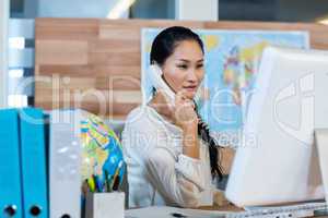 Pretty businesswoman having phone call