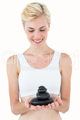 Fit woman holding stones