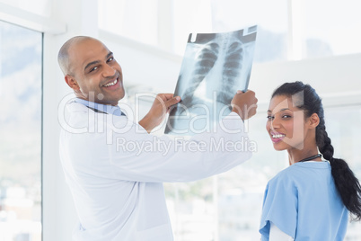 Doctors analyzing together xray