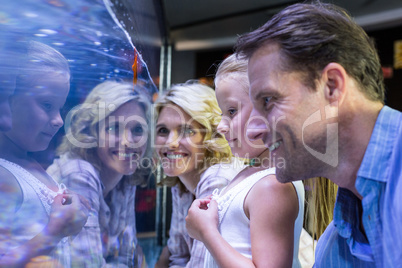 Family looking at starfish in a tank