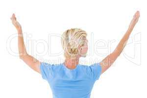 Blonde woman gesturing back to camera