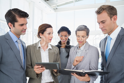 Business people with tablet and notebook